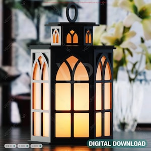May include: A black and white decorative lantern with a handle, featuring arched window cutouts. The lantern has a warm, glowing interior, and the words "DIGITAL DOWNLOAD" are visible at the bottom.