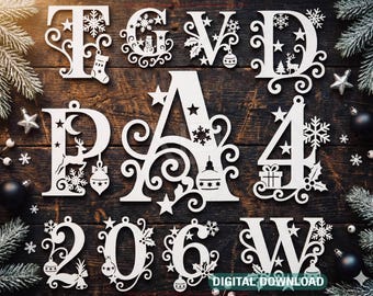 May include: White wooden Christmas ornaments in the shape of letters and numbers, including snowflakes, stars, and holiday-themed designs. The ornaments are arranged on a dark wooden surface with pine branches and ornaments.