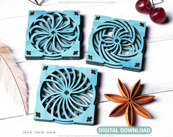 May include: Three blue wooden coasters with intricate geometric designs. The coasters are square and have a light blue stain with dark blue accents. The coasters are stacked on top of each other.