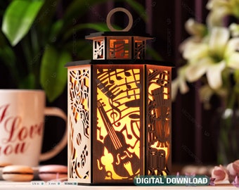 May include: A wooden lantern with a light inside, featuring a musical theme with cutouts of musical notes, a guitar, a violin, and drums. The lantern is lit and casts a warm glow.