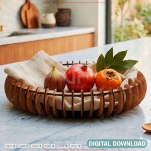 May include: A wooden fruit bowl with a light-colored fabric lining, holding a fig, a pomegranate, and a persimmon. The bowl is on a marble countertop. The text "DIGITAL DOWNLOAD" is visible.