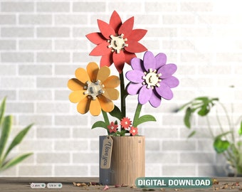 May include: A papercraft flower bouquet with three flowers in red, yellow, and purple. The flowers are in a brown cardboard pot with a tag that says "I love you".