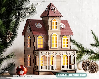 May include: A wooden Christmas house with a red roof and lit windows. The house has a porch with a railing and is decorated with intricate details. The house is sitting on a white surface with pine branches and ornaments.
