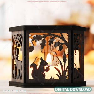 May include: A dark brown wooden lantern with laser-cut forest scene silhouettes. The design includes a squirrel, deer, trees, and foliage. The lantern has a candle inside, and the text "DIGITAL DOWNLOAD" is at the bottom.