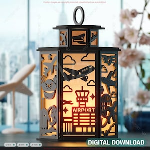 May include: Black lantern with cut-out designs of airplanes, clouds, and airport elements. The word "AIRPORT" is visible. The lantern has a handle and is lit from within, creating a warm glow. The text "DIGITAL DOWNLOAD" is at the bottom.