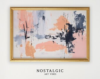 May include: Abstract art print in a gold frame. The artwork features a blend of peach, navy, gray, and white brushstrokes. The text "NOSTALGIC ART VIBES" is printed in a minimalist font at the bottom of the frame.