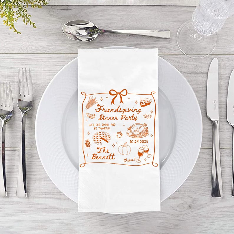 May include: White Friendsgiving dinner party napkin with a brown decorative border and illustrations of food and drinks. The text includes "Friendsgiving Dinner Party", "Let's Eat, Drink, and Be Thankful!", "The Bennett", and the date 10.29.2025.