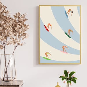 May include: A framed illustration of five women surfing on blue and white waves. The women are all wearing bikinis and are riding different colored surfboards.