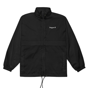 May include: Black windbreaker jacket with a stand-up collar, front pockets, and a drawstring hem. The jacket has a full-length zipper and the text "Stugots II" is printed on the chest.