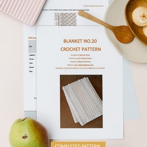 May include: A crochet pattern for a blanket, titled "Blanket No. 20 Crochet Pattern". The pattern is designed by Daisy & Peace and includes 7 pages. The pattern is for a white blanket with a textured stitch.
