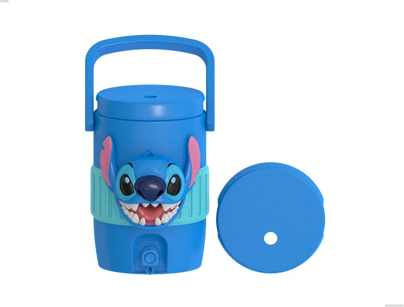 May include: A bright blue beverage cooler featuring a raised, three-dimensional graphic of the character Stitch on the front. The cooler includes a top handle, a small spigot at the base, and a separate circular lid with a central hole for a straw.