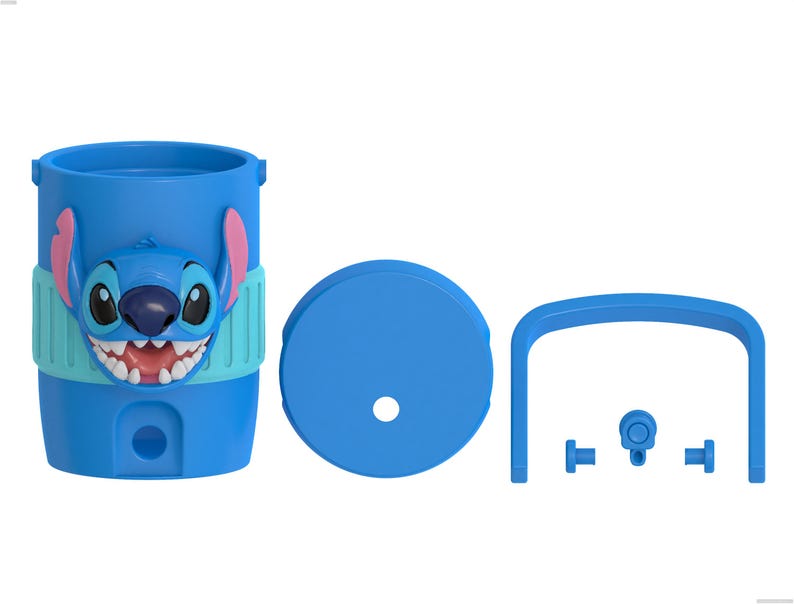 May include: A blue plastic tumbler featuring a raised Stitch character face with pink ears and a wide grin. The set includes a matching blue circular lid with a center hole, a blue arched handle, and three small blue components for assembly.