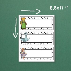 May include: A sheet of three name tags, each with a white rectangular space for writing, surrounded by a black dotted border. Illustrations of a teddy bear, a pigeon, and a girl decorate the left side. The sheet measures 21.6 x 27.9 cm.