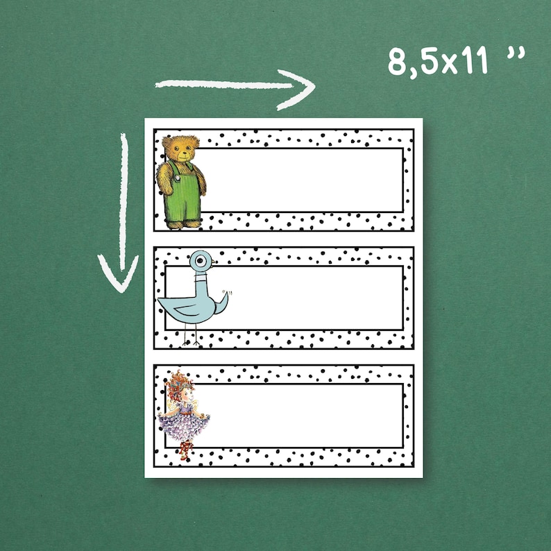May include: A sheet of three name tags, each with a white rectangular space for writing, surrounded by a black dotted border. Illustrations of a teddy bear, a pigeon, and a girl decorate the left side. The sheet measures 21.6 x 27.9 cm.