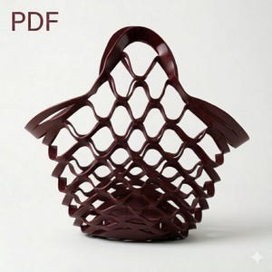 May include: A burgundy-colored, open-weave basket with a handle. The basket's design features a repeating diamond pattern, creating an airy and decorative storage solution. The word "PDF" is in the upper left corner.