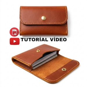May include: A brown leather card holder, closed with a gold snap, and open to reveal cards inside. The text "TUTORIAL VIDEO" is displayed below the card holder.