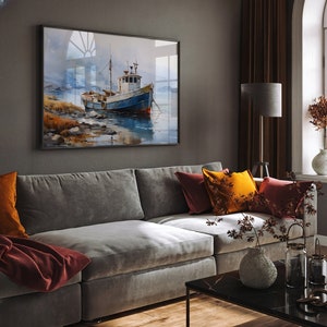 May include: A grey sectional sofa with red and yellow throw cushions in a living room with a framed watercolour painting of a blue fishing boat on the wall.