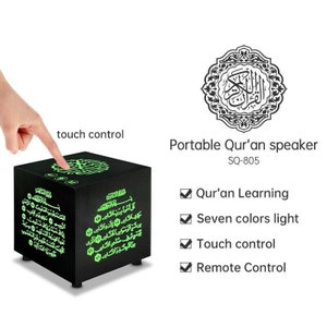 May include: A black, cube-shaped portable Qur'an speaker with touch control. The speaker has green illuminated Arabic script and icons. The text on the side of the speaker is also in green. The speaker is labeled "SQ-805".