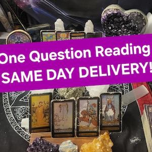 May include: A tarot card reading spread with five cards laid out on a black cloth with crystals and a heart-shaped amethyst. The cards are "The Empress", "Ace of Swords", "Knight of Wands", "8 of Swords", and "Queen of Swords". The text "One Question Reading SAME DAY DELIVERY!" is superimposed on the image.