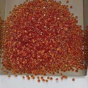 2.5 mm Natural Only Heated Dark Orange Sapphire Round Brilliant cut