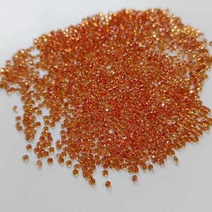 2 mm Natural Only Heated Dark Orange Sapphire Round Brilliant cut