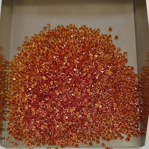1 mm Natural Only Heated Dark Orange Sapphire Round Brilliant cut