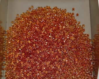 1 mm Natural Only Heated Dark Orange Sapphire Round Brilliant cut