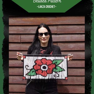 May include: A rectangular beaded wall hanging featuring a red flower with green leaves on a white background, framed by black borders. The text reads TRADITIONAL TATTOO FLOWER, Beaded Pattern, ~LAKZA CROCHET~, SKILL LEVEL, and Beginner.