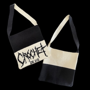 May include: Two black and white crocheted tote bags with a black strap. One bag has the word "CROCHET" in black lettering with the text "OK. DIE" underneath.