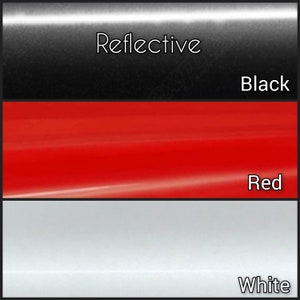 May include: Three samples of reflective vinyl in black, red, and white. The vinyl is labeled "Reflective".