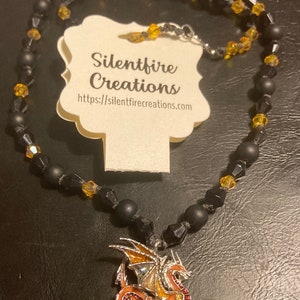 Enameled brown dragon necklace with black and orange beads 157