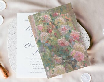 May include: A white wedding invitation card with black serif and script text, partially covered by a rectangular vellum overlay featuring an impressionistic oil painting of pink roses and green foliage, accented by a gold paper clip.