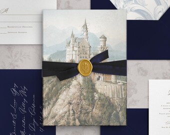 May include: A wedding invitation suite featuring a central card with a castle illustration, wrapped in a dark blue ribbon with a gold wax seal. Includes a dark blue envelope with white calligraphy, a white RSVP card, and an envelope with a floral liner.
