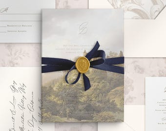 May include: A wedding invitation suite featuring a central card with a landscape illustration, tied with a navy blue ribbon and a gold wax seal. The set includes matching envelopes, a response card, and an addressed envelope with calligraphy.