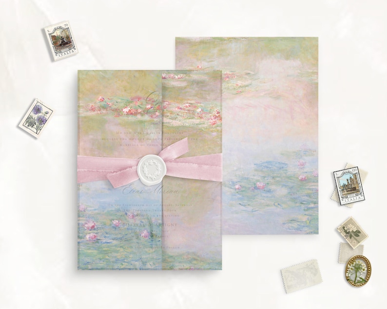 May include: A set of two blank cards with a watercolor design of water lilies and a pink ribbon tied around them. The cards are perfect for writing a special message.