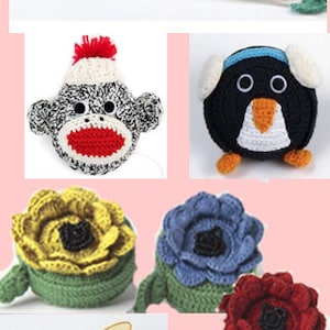 Könnte beinhalten: Eine Sammlung von gehäkelten Maßbandhaltern mit verschiedenen Tier- und Blumenmotiven. Die Motive umfassen eine Eule, ein Schaf, einen Kuchen, einen Affen, einen Pinguin, eine Sonnenblume, eine blaue Blume, eine rote Blume, eine Biene, einen Marienkäfer und ein Blatt mit Marienkäfern.