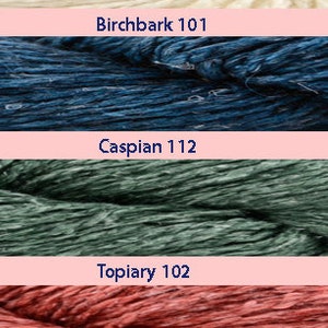May include: Close-up of four yarn skeins in different colors: off-white, blue, green, and red. The yarn skeins are labeled with the names and numbers "Birchbark 101", "Caspian 112", "Topiary 102", and "Henna 108".