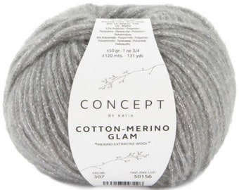May include: A ball of silver gray yarn with a white label that reads "CONCEPT by KATIA COTTON-MERINO GLAM "MERINO EXTRAFINE WOOL" COLOR 307 TINT/DYE LOT 50156".