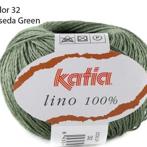 May include: A ball of Katia Lino 100% linen yarn in color 32, Reseda Green. The yarn ball has a white label with the Katia logo and the text "lino 100%".