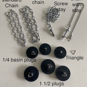 May include: Assortment of sink chain and stopper plugs.  Includes two 18 inch chains, one with a closed loop and one with a screw stay.  Also includes a basin chain with a triangle stay, four 1/4 inch basin plugs, and four 1 1/2 inch basin plugs.