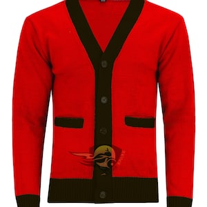 May include: A red cardigan sweater with black trim on the collar, pockets, and button placket. The sweater has long sleeves and a ribbed hem and cuffs. The sweater has a logo on the lower right side. The sweater has five buttons.