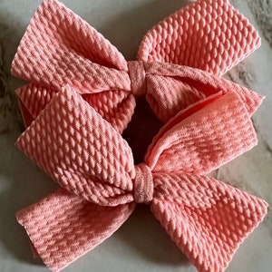 5’ light coral Piggie tail bows