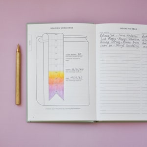 May include: A reading challenge journal with a colourful bookmark and a list of books to read. The journal has a total of 10 books to read, starting on 08/03/20 and ending on 11/01/20. The list of books includes "Educated" by Tara Westover, "Just Mercy" by Bryan Stevenson, "Rising Strong" by Brene Brown, and "Lean In" by Sheryl Sandberg.
