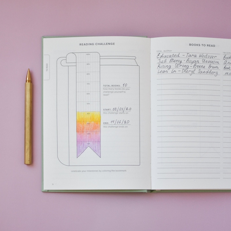 May include: A reading challenge journal with a colourful bookmark and a list of books to read. The journal has a total of 10 books to read, starting on 08/03/20 and ending on 11/01/20. The list of books includes "Educated" by Tara Westover, "Just Mercy" by Bryan Stevenson, "Rising Strong" by Brene Brown, and "Lean In" by Sheryl Sandberg.