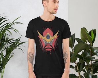 May include: A black t-shirt with a graphic of a yellow and red robot head. The robot head has a yellow helmet with a red visor and a red mouth.