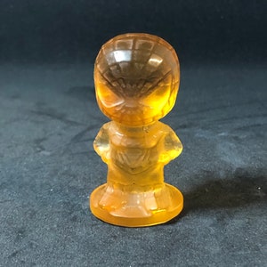 Honey Colored Spider Web Shooting Superhero Figurine Carving