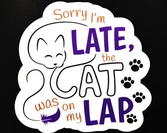 May include: White sticker with a purple and orange design. The sticker says "Sorry I'm LATE, the CAT was on my LAP". There is a cartoon cat with a tail and paw prints around the text.