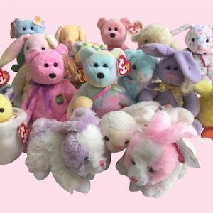 May include: A collection of pastel-coloured Beanie Babies, including a chick, duck, bunny, lamb, and bear. The toys are all in various poses and have the signature Beanie Baby tags.