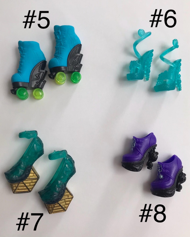 May include: Four pairs of doll shoes labeled #5 through #8. Pair #5 are blue roller skates with black accents and green wheels. Pair #6 are translucent teal strappy heels. Pair #7 are dark green heels with gold geometric bases. Pair #8 are purple boots.