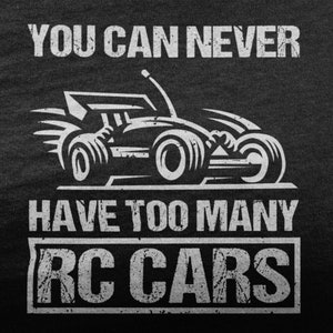 May include: A black t-shirt with white text that reads "You can never have too many RC cars". A white silhouette of a race car is in the center of the shirt.